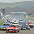 Group 1 Saloons turn into the first corner at Goodwood